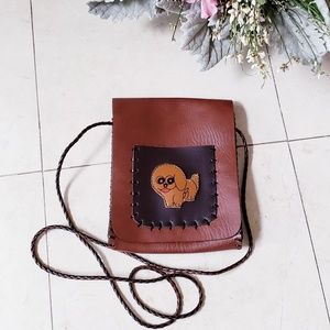 faux leather puppy dog braided strap crossbody bag